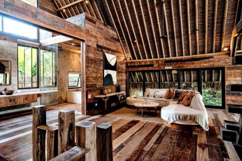 Rustic living room with wooden interiors, large wi