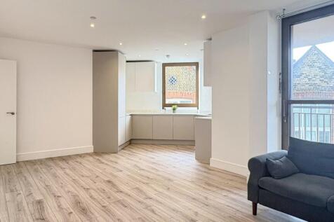 Bright, modern living area with large window an...