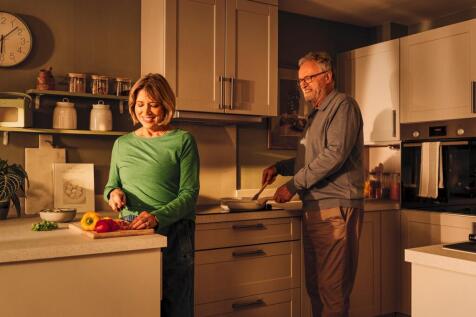 a man and a woman in a kitchen
