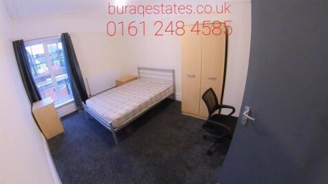 Bright bedroom with ample storage and desk area...