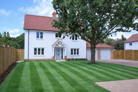 Two-story house with striped lawn.png