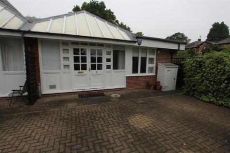 Charming entrance with private paved patio...