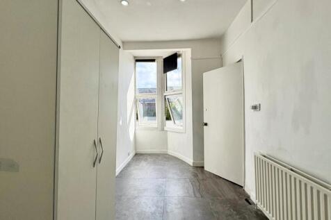 Bright and clean bedroom with built-in wardrobe...