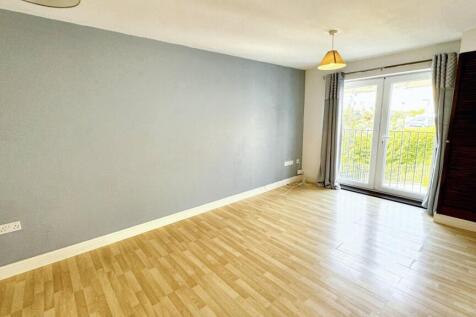 Bright living room with stylish French doors....
