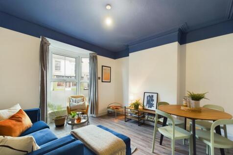 Bright and inviting living room featuring natur...