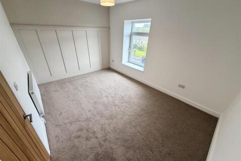Bright modern bedroom with stylish wall panelin...