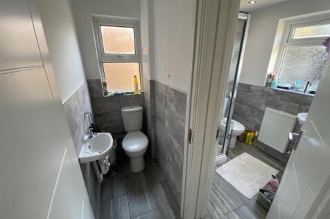 Modern bathroom with sleek grey tiling...