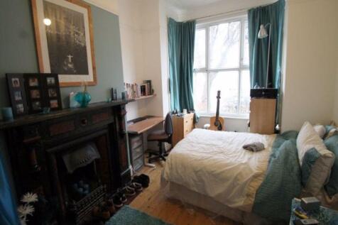 A cozy and inviting master bedroom featuring a ...