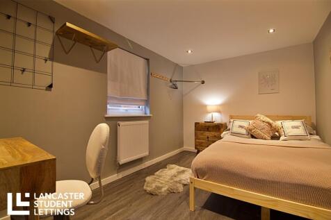 Stylish master bedroom with dedicated desk area...