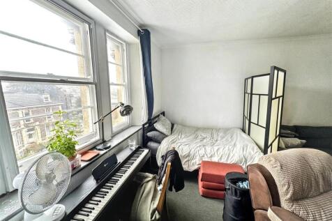 Bright and spacious bedroom with large windows...