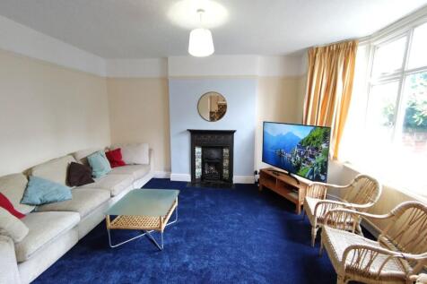 Bright, comfortable living room with a large ba...