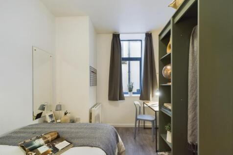 A bright and inviting double bedroom featuring ...