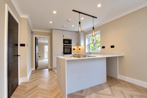 Modern Marble Kitchen with Pendant Lighting.png