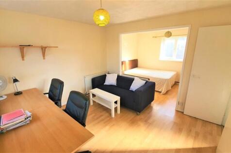 Spacious master bedroom with dedicated study ar...