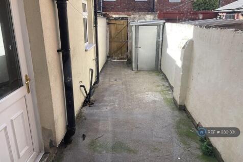 Back Yard With Small Lockable Shed