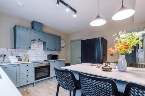 Modern kitchen with island and stylish cabinets...