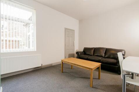 Bright and spacious living room featuring a com...