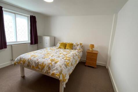 Bright room with double bed and storage...
