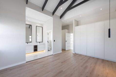 Main ensuite bedroom with built in cupboards