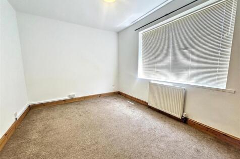 Bright and airy bedroom with large windows...