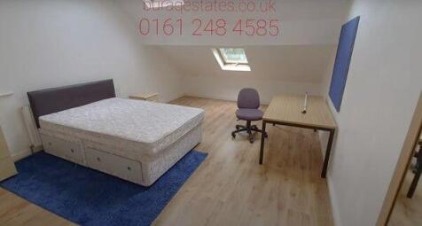 Spacious bedroom with double bed and study desk...