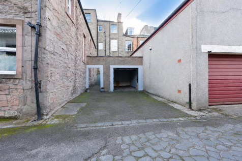 Leaf-Free Stone Courtyard Garage.png
