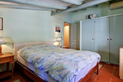 bedroom with built in wardrobes and air-conditioning