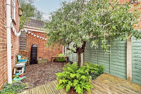 Tiered Garden with plenty of seating areas, flagged, decked and mixed lawn.