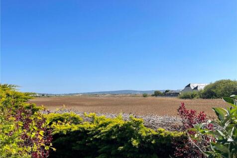Isle of Wight in distance and Sturt Pond at rear