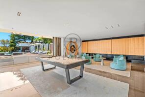 A modern, open-plan living space with a sleek bill