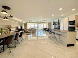 Spacious modern open-plan living area with sleek k