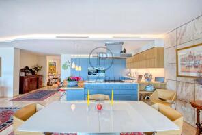 Modern kitchen with bright blue cabinetry and open