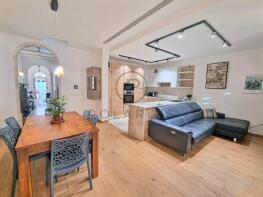 Modern open-plan living space with a kitchen, sofa