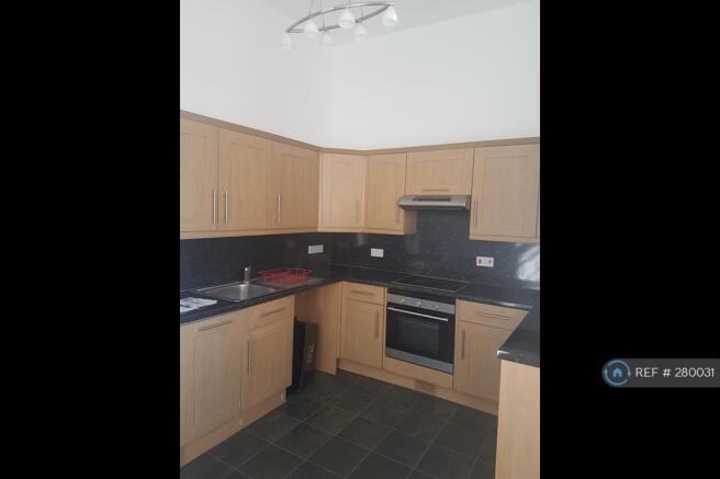 Kitchen With Dishwasher And Electric Hob And Oven
