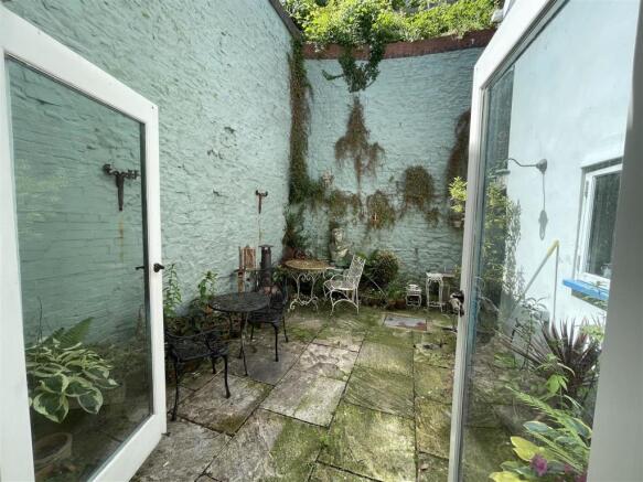 OUTSIDE - WALLED COURTYARD