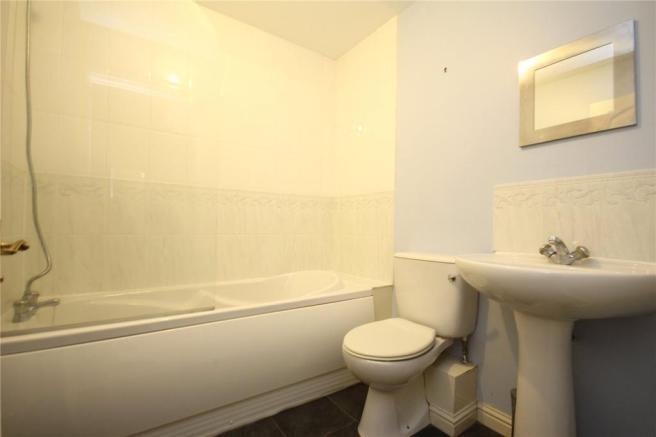 Well-maintained bathroom with a full-size batht...