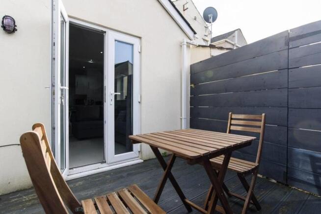 Private decked terrace with stylish bistro set...