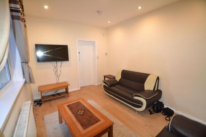 A welcoming living room featuring a modern dark...