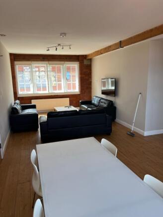 Bright and spacious living area featuring large...