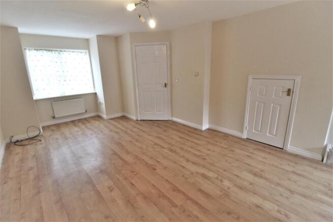 Large Living Room With Storage Cupboard