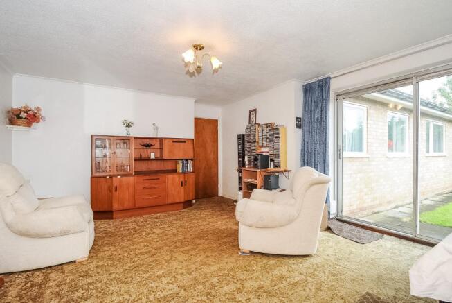 Living room with patio doors to the gardens
