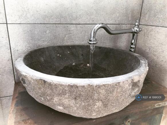 Bathroom Sink Carved From a River Stone