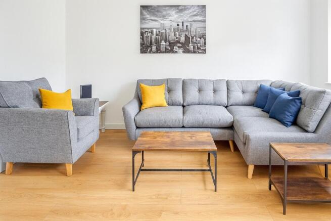 Bright and inviting living room featuring conte...