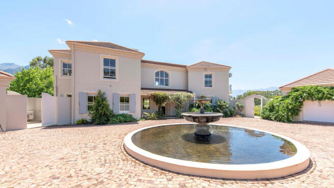 ENTRANCE FROM THE GARAGES/DRIVEWAY