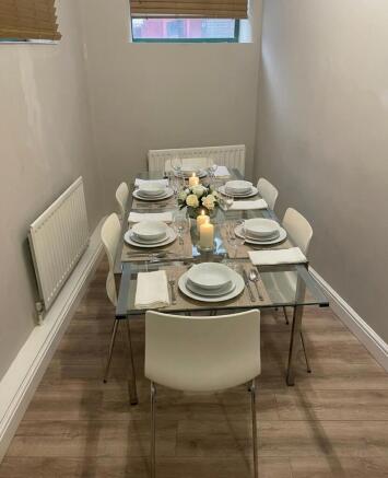 Neat, contemporary dining area with a glass tab...