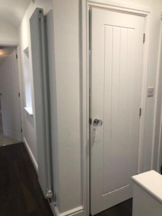 The first door in front of the stairs