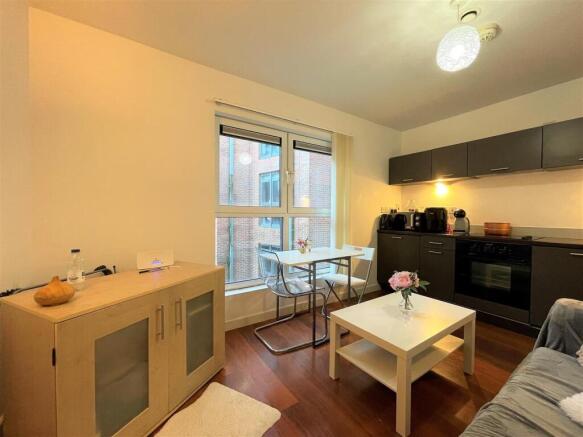 Bright open-plan living area with modern finish...