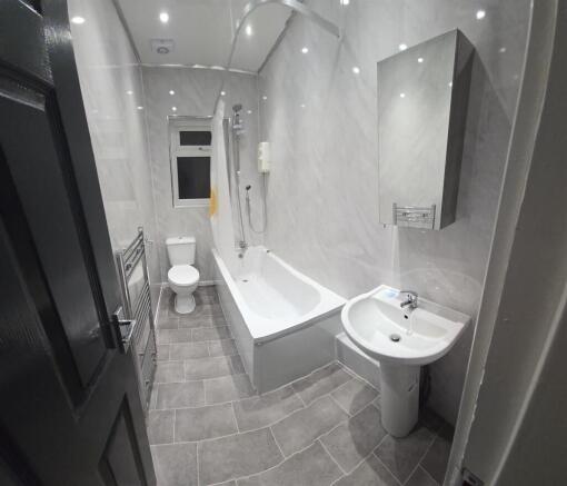 Modern bathroom suite with sleek marble-effect...