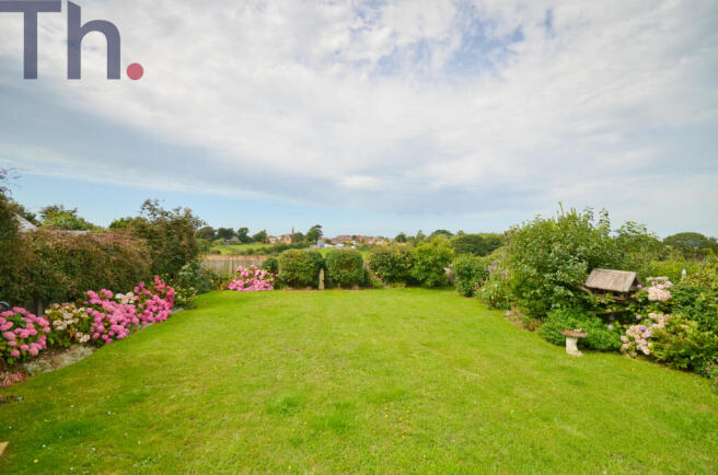 Lawned Garden with views of Gurnard village.JPG