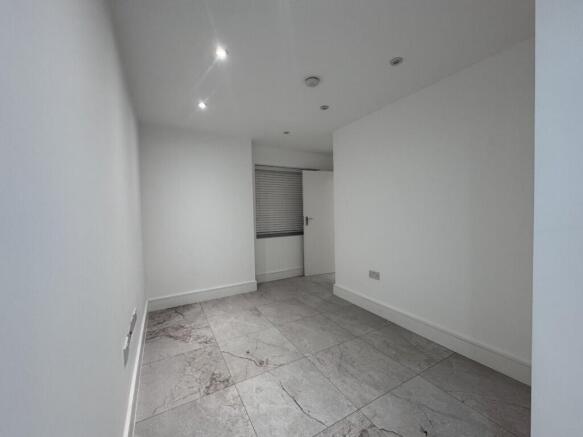 Long narrow interior room with recessed ceiling...